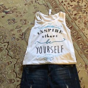 Girls tank top and distress skinny jeans.